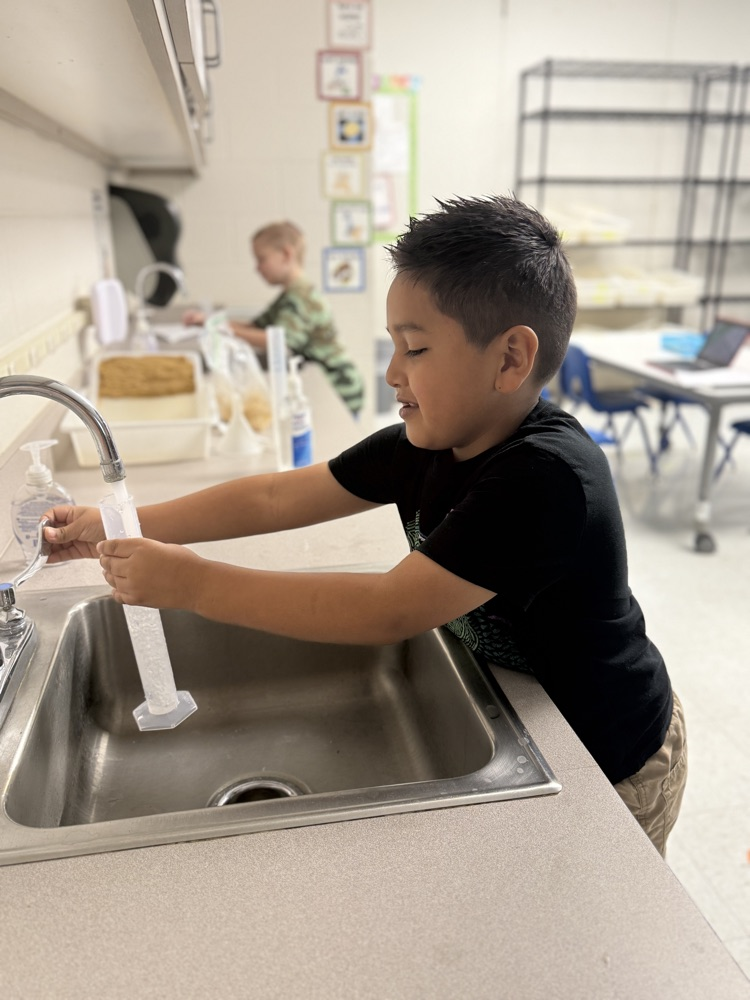 Second graders learn how to use graduated cylinders in STEM Class with Mrs. Morgan 