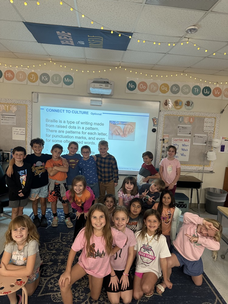 In math Ms. Matt's class learned about Braille during their Connect to Culture unit. Students then got to feel the braille room numbers.