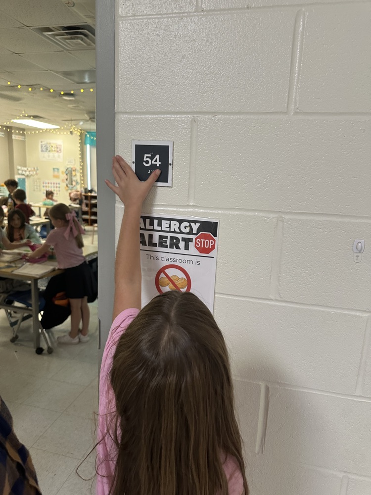 In math Ms. Matt's class learned about Braille during their Connect to Culture unit. Students then got to feel the braille room numbers.