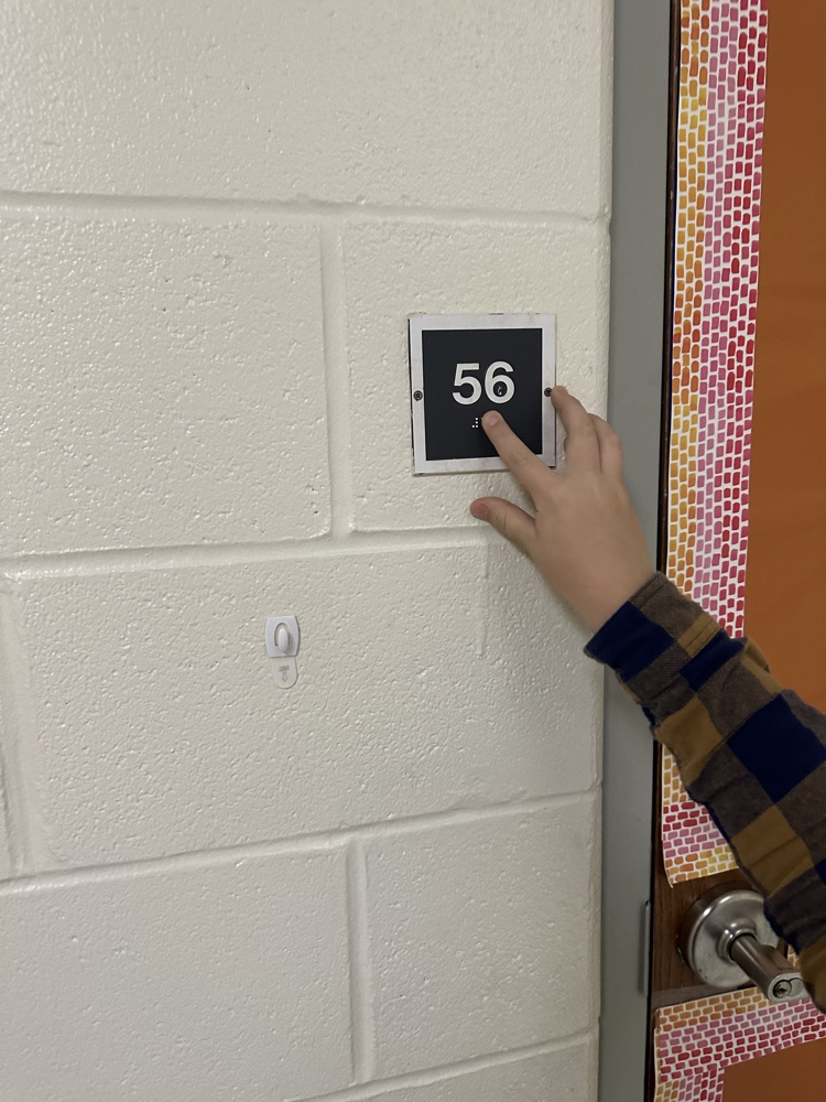 In math Ms. Matt's class learned about Braille during their Connect to Culture unit. Students then got to feel the braille room numbers.