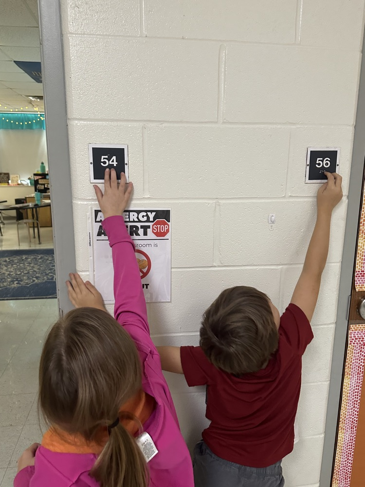 In math Ms. Matt's class learned about Braille during their Connect to Culture unit. Students then got to feel the braille room numbers.