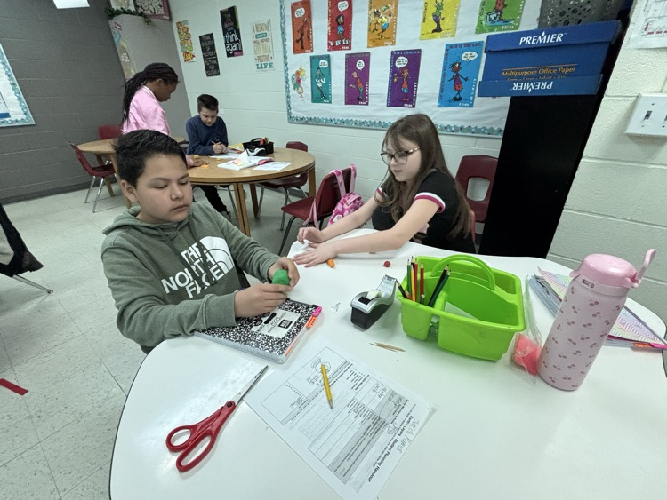 students working on science models 