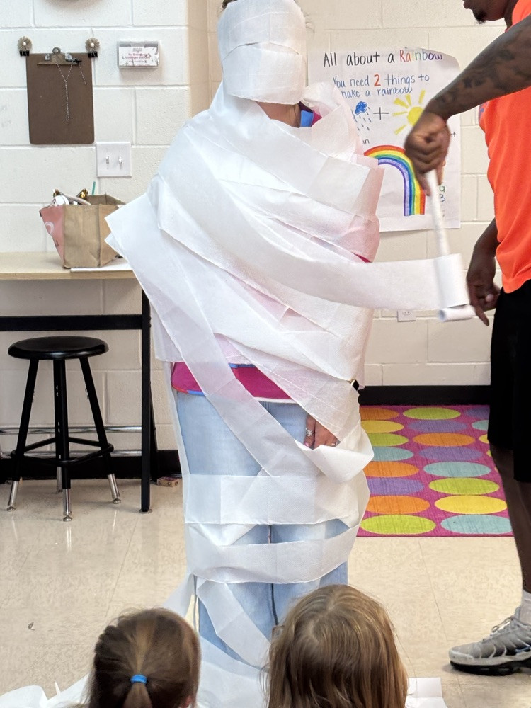 These teachers got wrapped like a mummy because their classes made one of the class goals! Great job! 