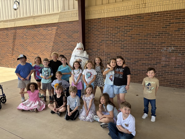 classes who earned a specific amount got to turn their teacher into a mummy