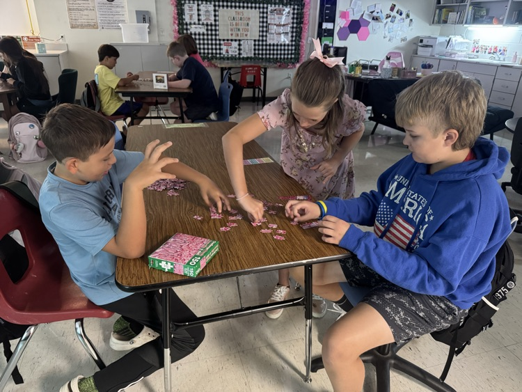 Students completing puzzles