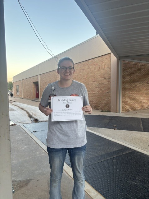 Teacher with award