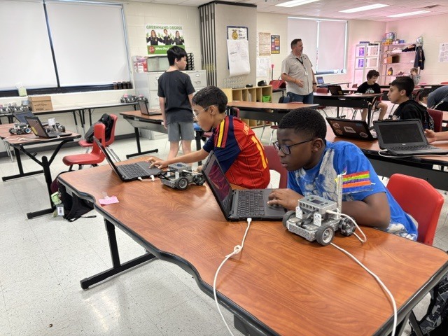 students working on robot