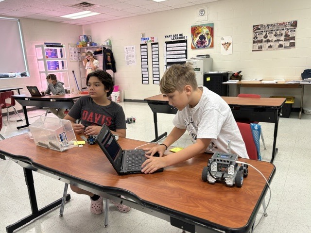 students working on robot