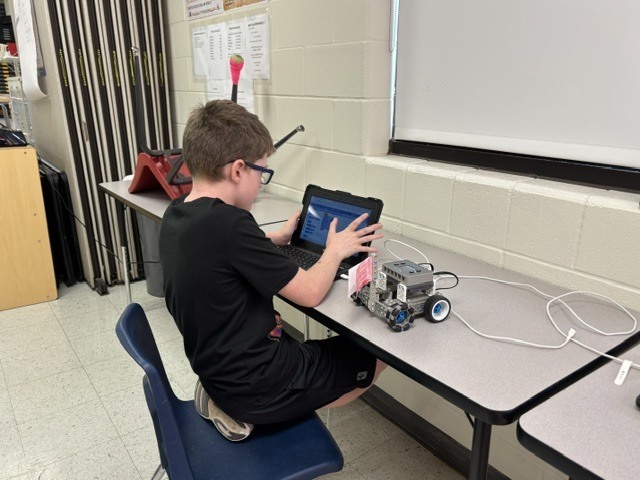 students working on robot