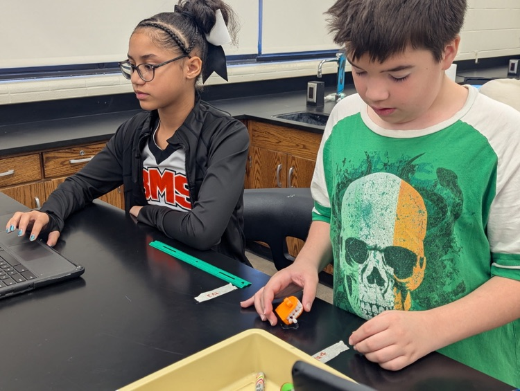 students completing science lab