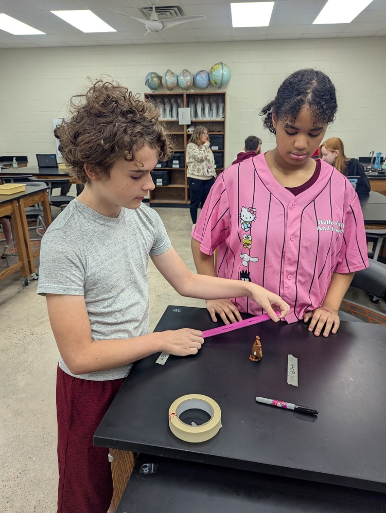 students completing science lab