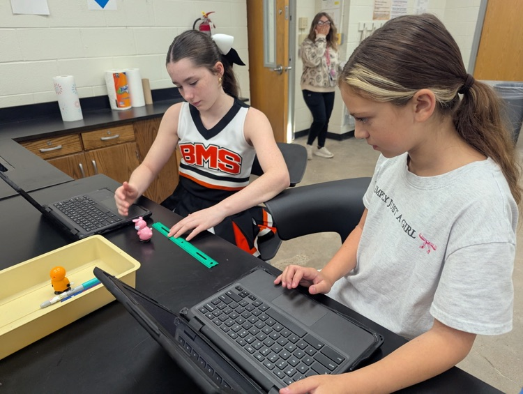 students completing science lab