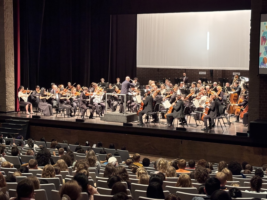 students watch symphony perform on stage at the COMMA