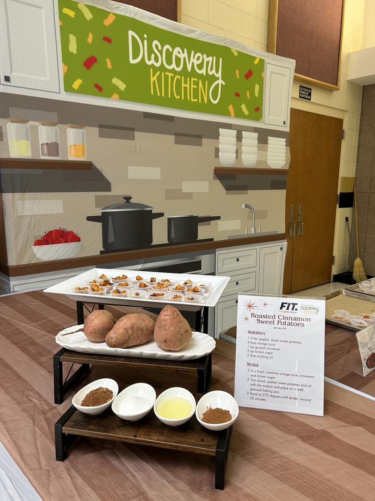 Discovery Kitchen table set up with sweet potatoes and ingredients