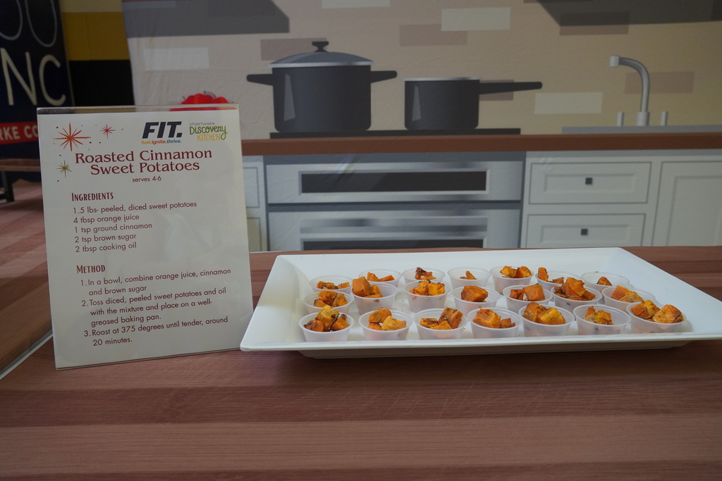 table of samples and a recipe for roasted cinnamon sweet potatoes