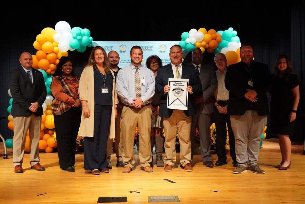 People on stage to acccept an award