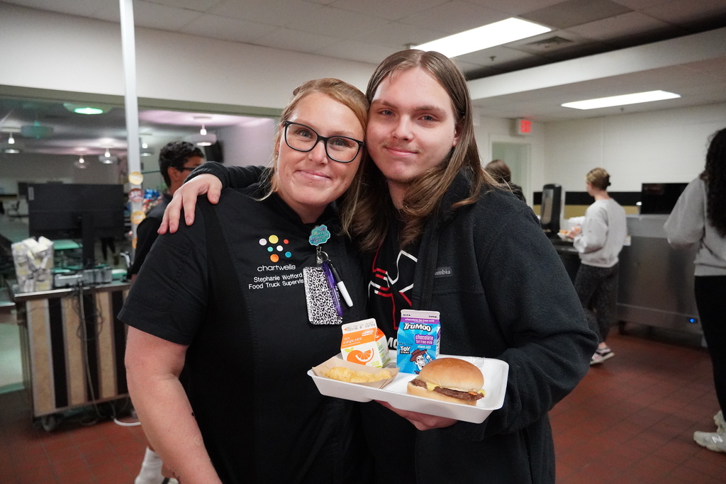 staff with student at lunch