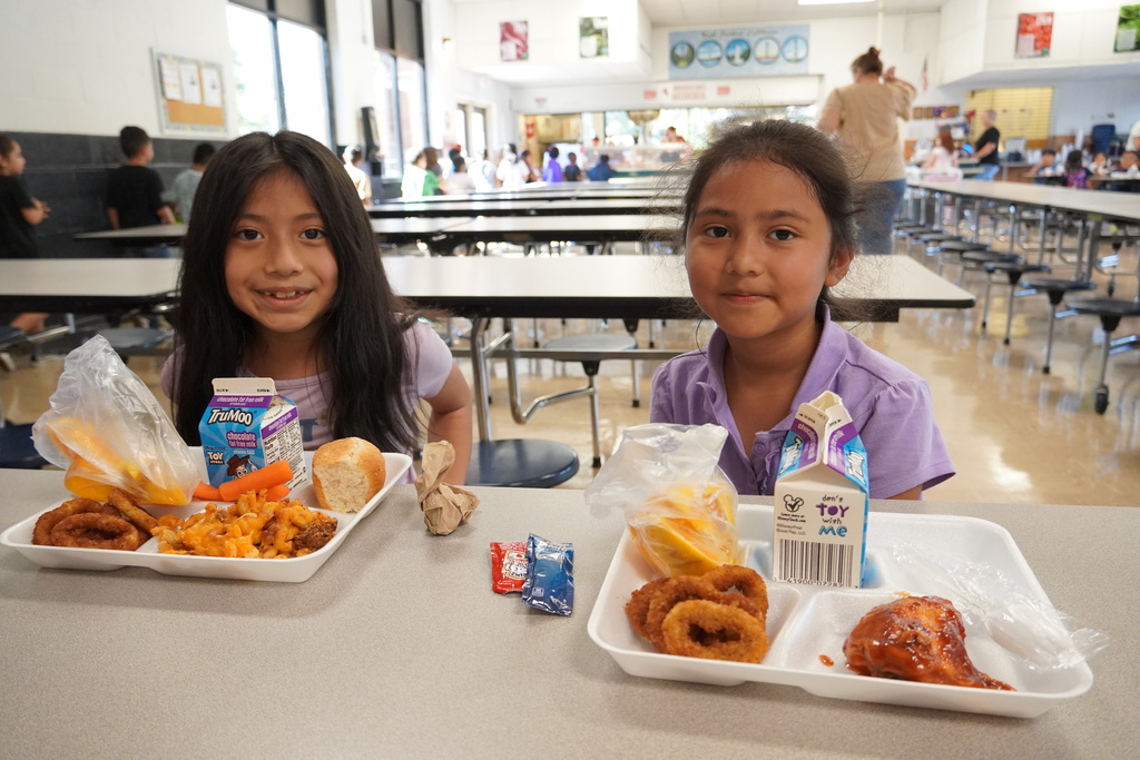 students smiling with lunches