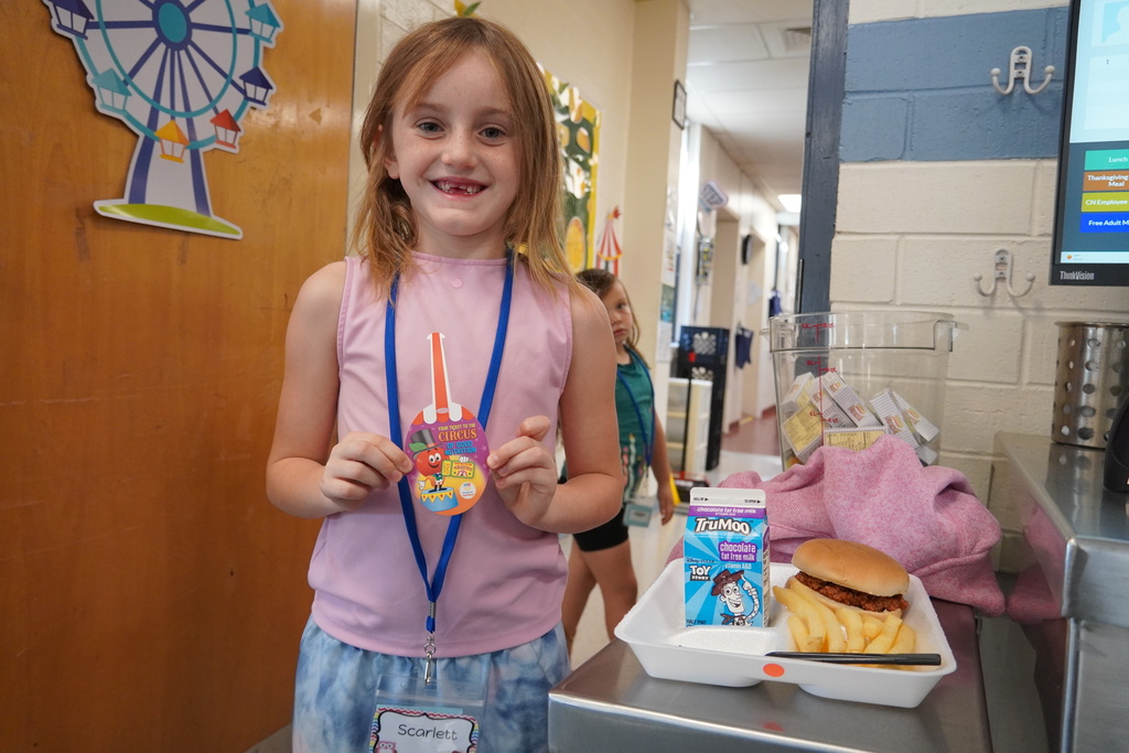 student holds a prize 