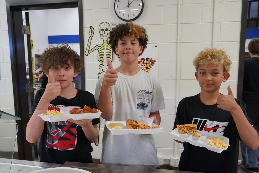 students smiling with lunches