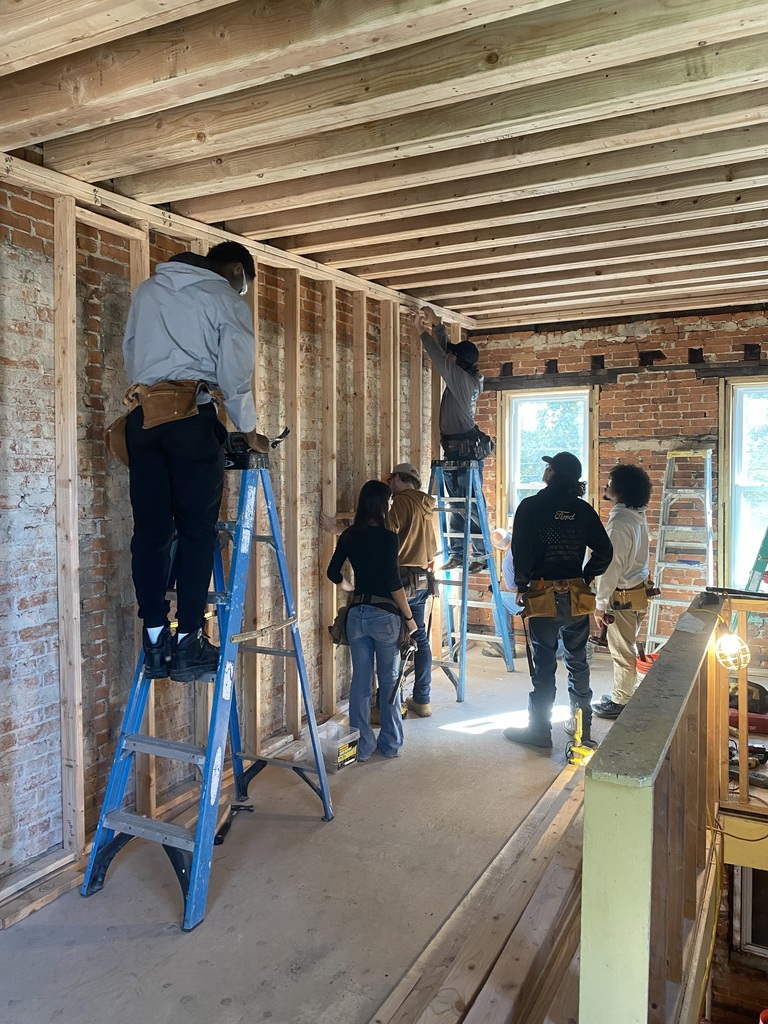 Same students working two on a ladder