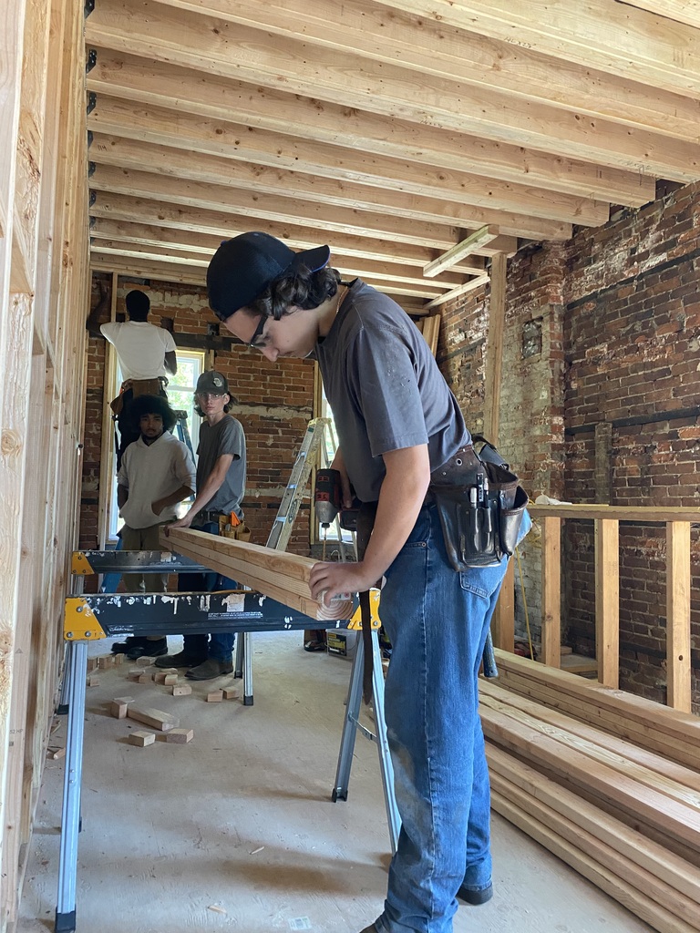 Two students working construction project 