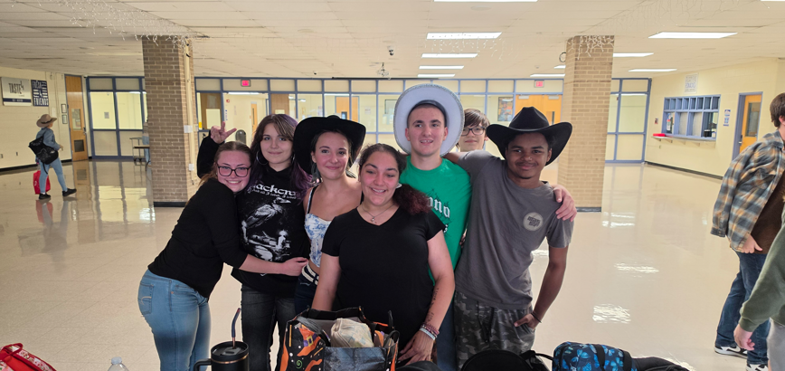 Medford students in the cafeteria. 6 students posing for a picture.