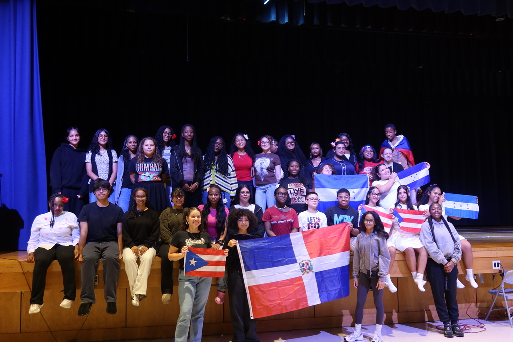 Westampton students who participated in the Hispanic Heritage Month celebration, holding flags.
