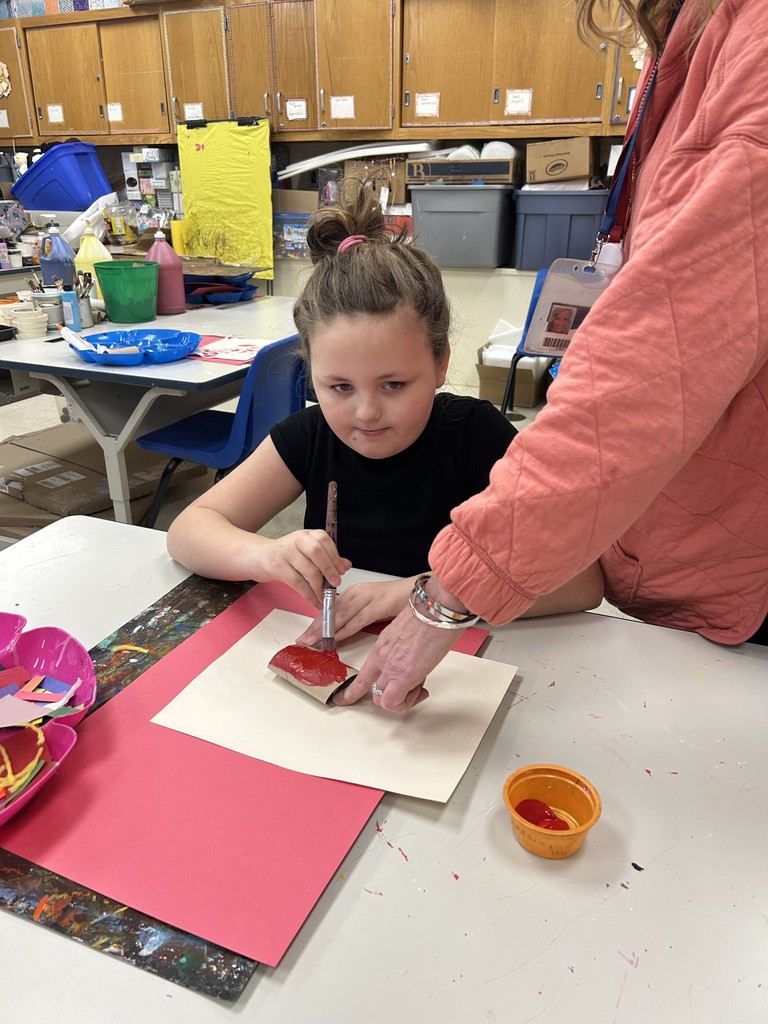 student doing art