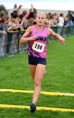 NDWB's Hannah Ritter crosses the finish line in 3rd place at the Grayhound Invite