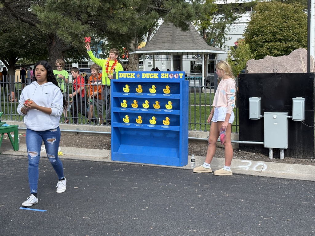 Students assisting with a carnival game.