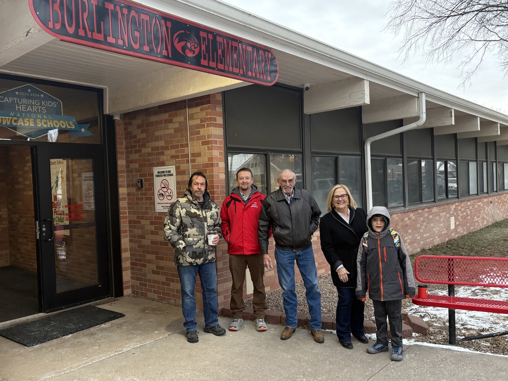 School board members outside the elementary school. 