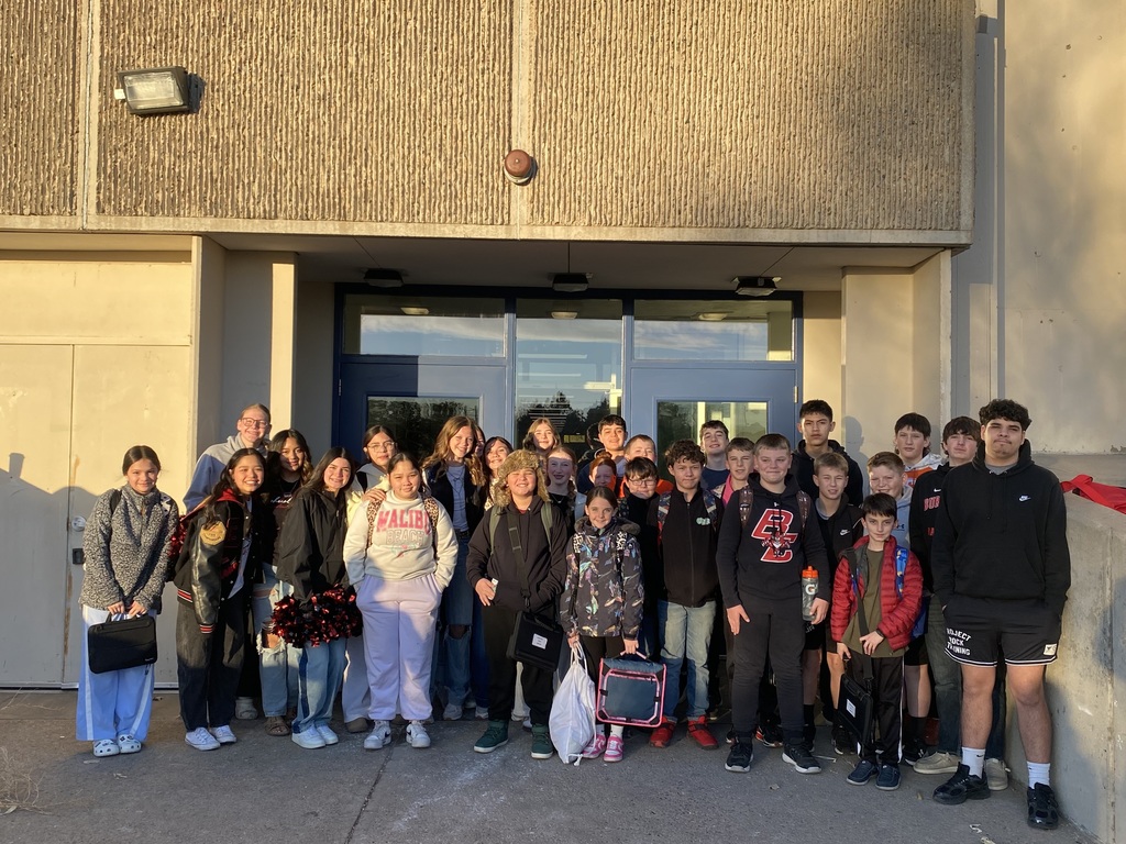 High schoolers greeting at the middle school. 
