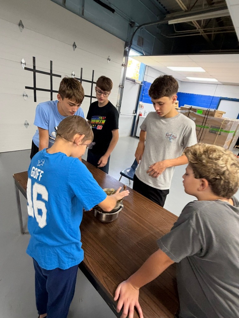 students making applesauce