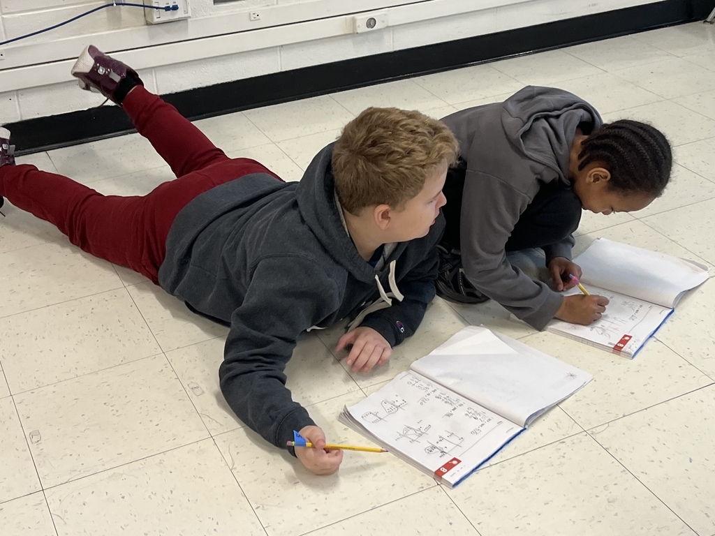 Mrs. Van Howe's 2nd Graders helping each other check their addition problems.