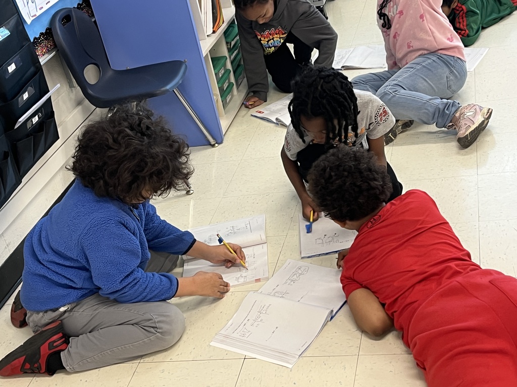 Mrs. Van Howe's 2nd Graders helping each other check their addition problems.