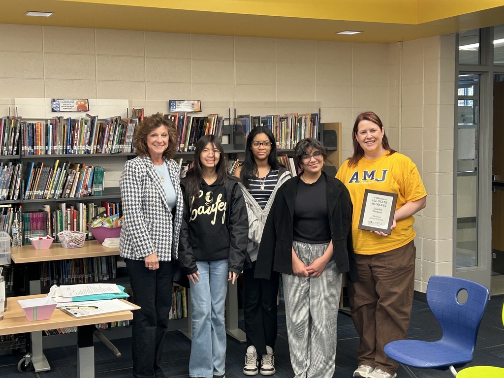School Board President McCormack, Ms. Brockman and choir students
