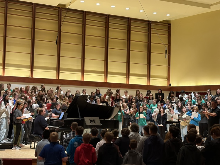 230 choir students singing together