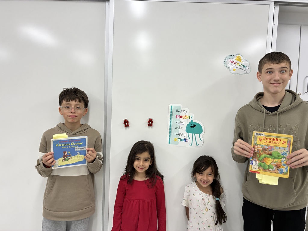 BRMS students reading to AMJ students.