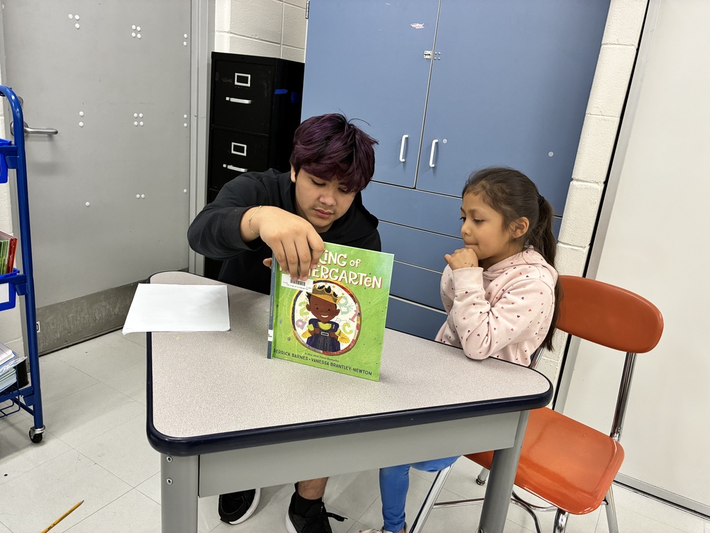 BRMS students reading to AMJ students.