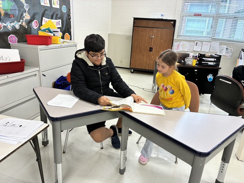 BRMS students reading to AMJ students.