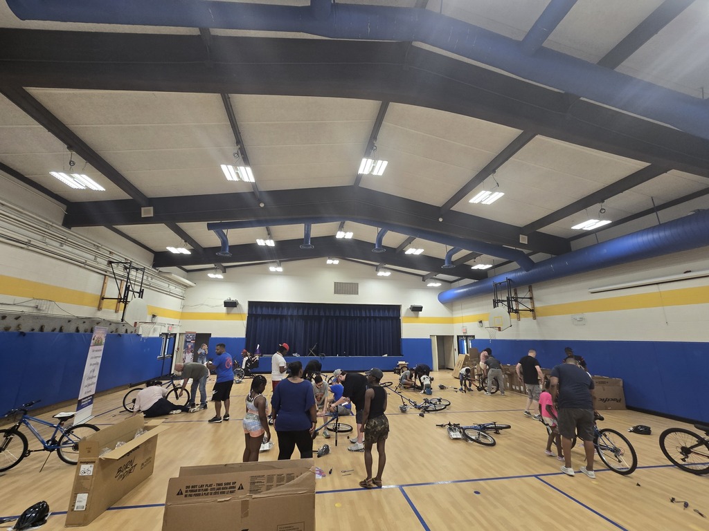 Student & Volunteers Building Bikes Together!
