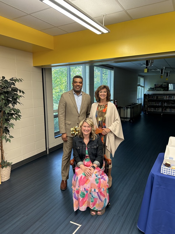 Lara Stripnieks with Superintendent Smith and School Board President McCormack