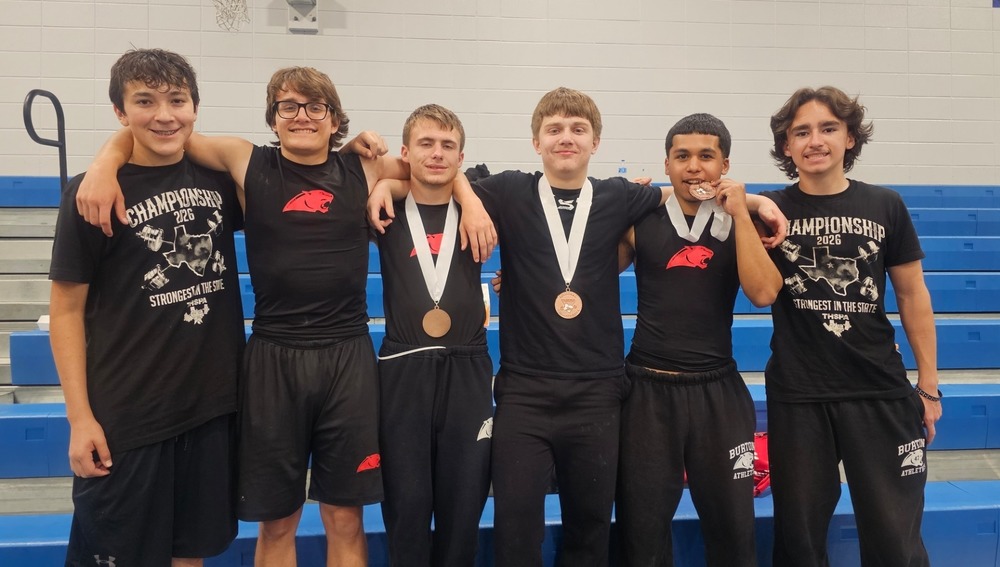 6 boys with powerlifting medals smiling