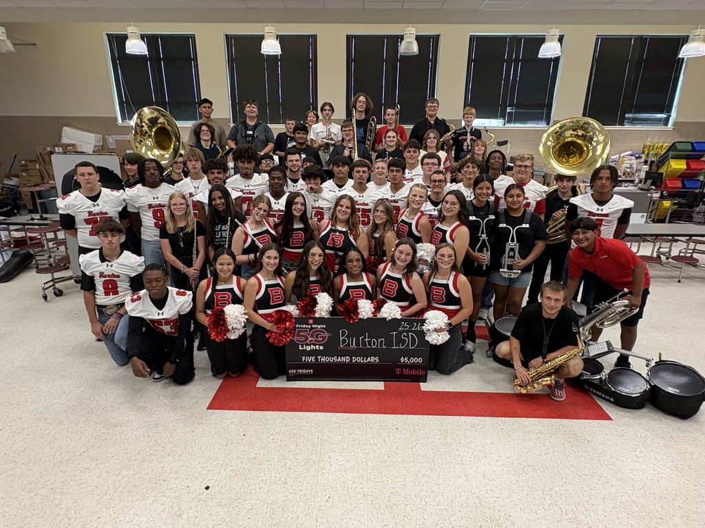 Burton Panthers students from band, cheer, and football holding oversized check.