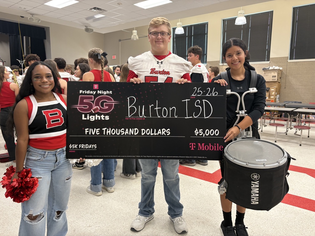 Cheerleader, football player, and drummer holding an oversized check for $5,000 payable to Burton ISD from TMobile