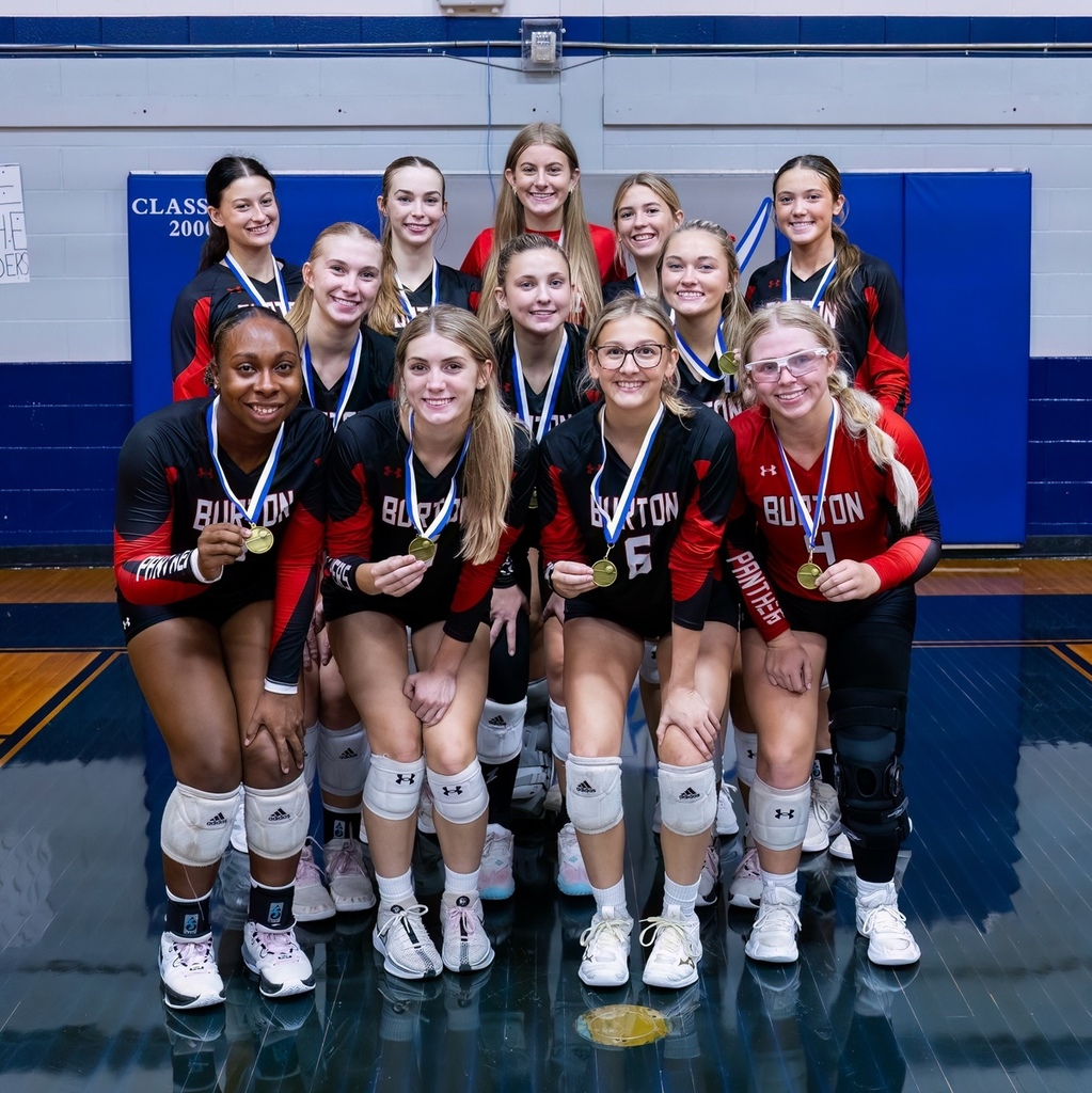 Lady Panther Volleyball players posing with medals