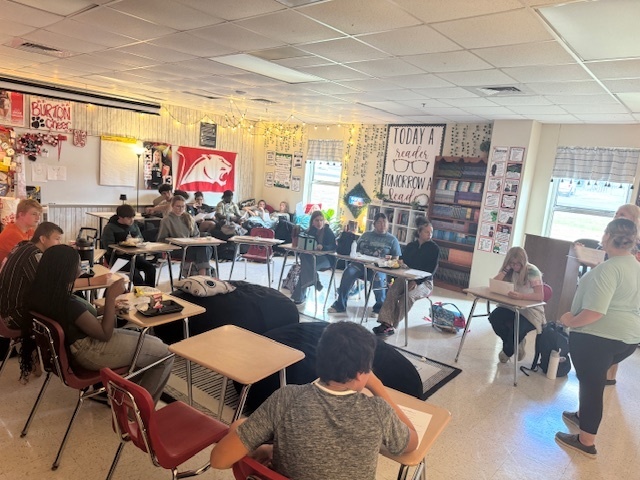 Student leading group of students in a student council meeting