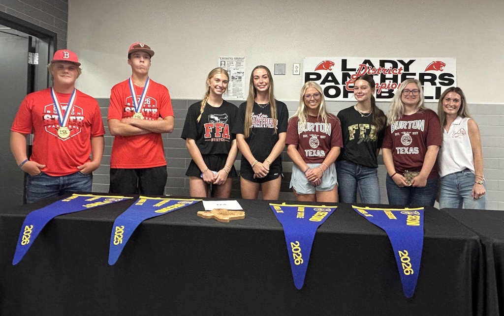 group of 2 boys and 6 girls, all high school age, smile at the camera.