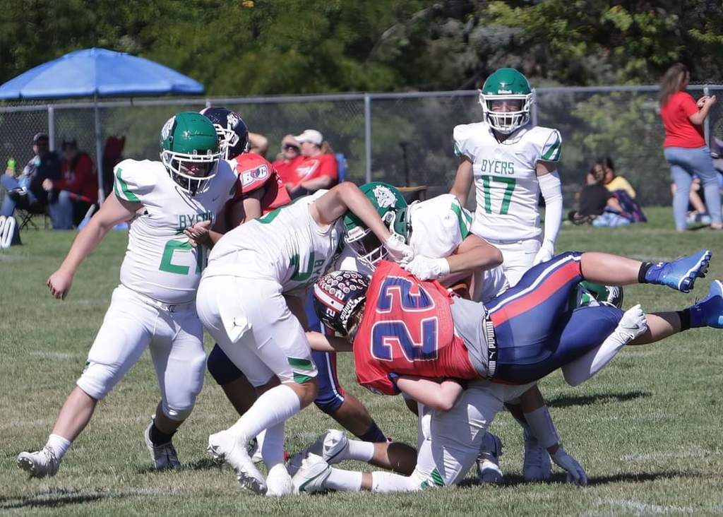 Football players tackling